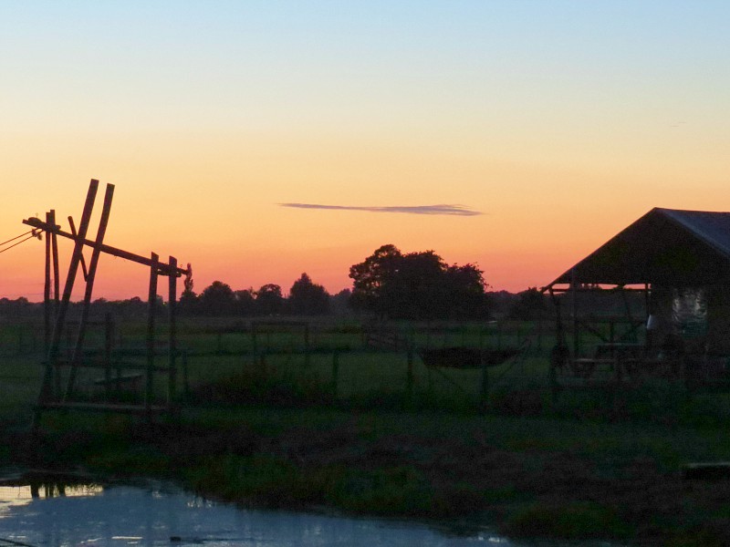 Zonsondergang op de boerderij