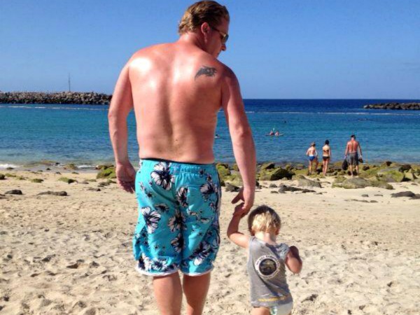 Vader en zoon op Amadores Beach