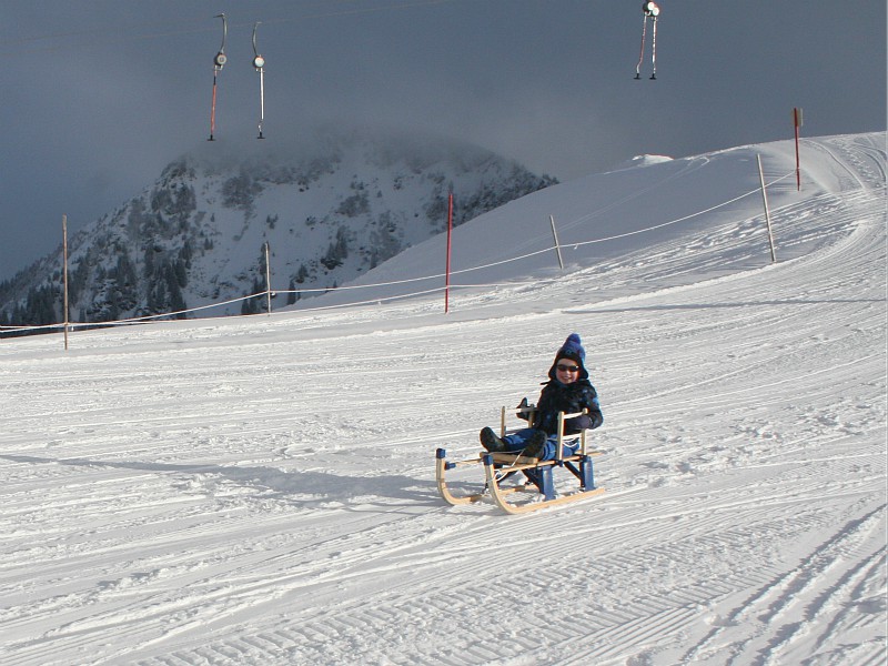 sleeënd de berg af