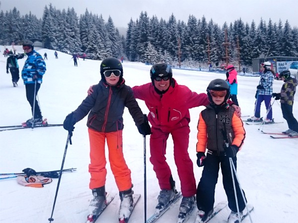 Samen met de skileraar op de foto