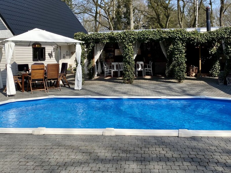 Een mooi zwembad bij dit kindvriendelijke vakantiehuis in Nederland